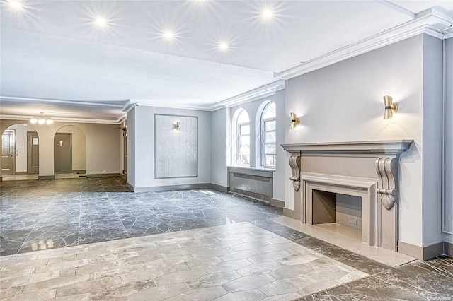 unfurnished living room featuring radiator and crown molding