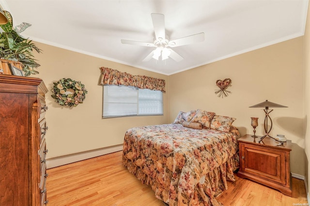 bedroom with ceiling fan, ornamental molding, a baseboard radiator, and light hardwood / wood-style floors