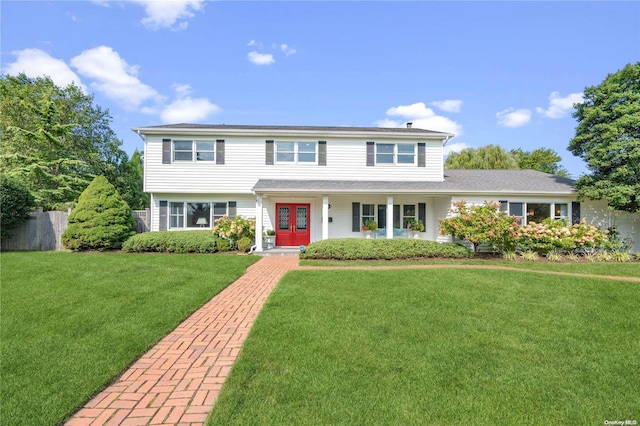 view of front of property featuring a front yard and french doors