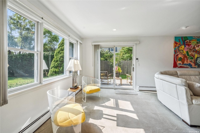 interior space with baseboard heating and plenty of natural light