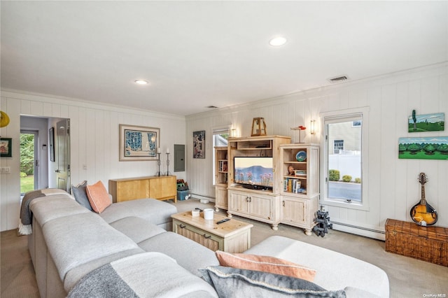 carpeted living room with electric panel, crown molding, wood walls, and a baseboard heating unit