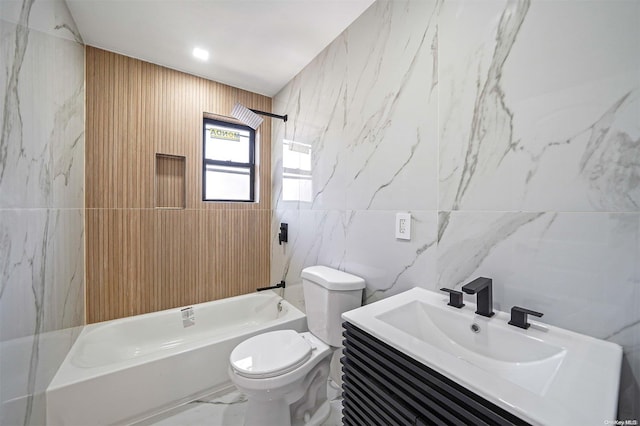 full bathroom with vanity, toilet, shower / bath combination, and tile walls