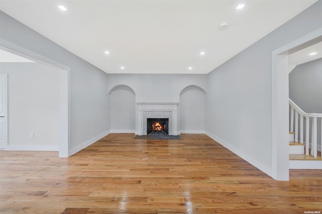 unfurnished living room with light hardwood / wood-style flooring