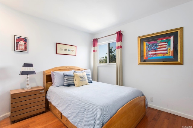 bedroom featuring hardwood / wood-style flooring