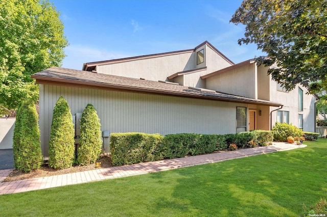 view of property exterior featuring a yard