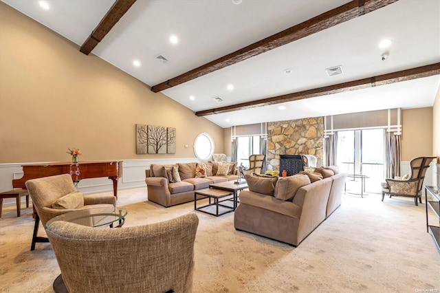 living room with light carpet, vaulted ceiling with beams, a stone fireplace, and a wealth of natural light