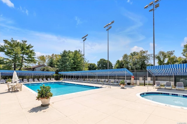 view of swimming pool featuring a patio area