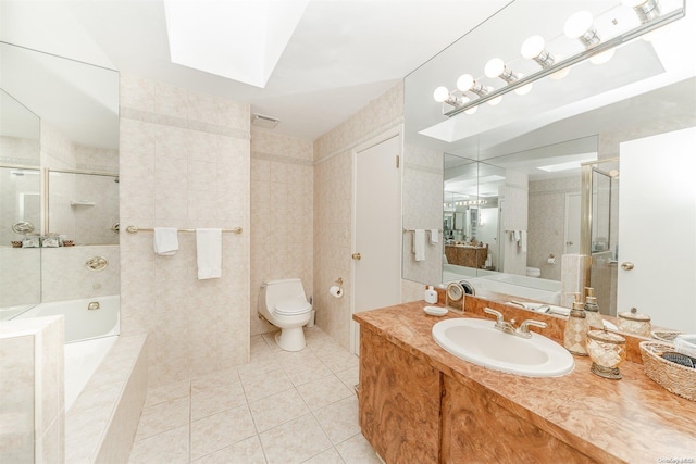 full bathroom with separate shower and tub, tile patterned flooring, vanity, and toilet