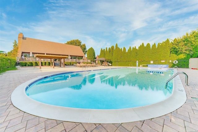 view of pool featuring a patio