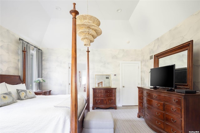 bedroom featuring light colored carpet and lofted ceiling