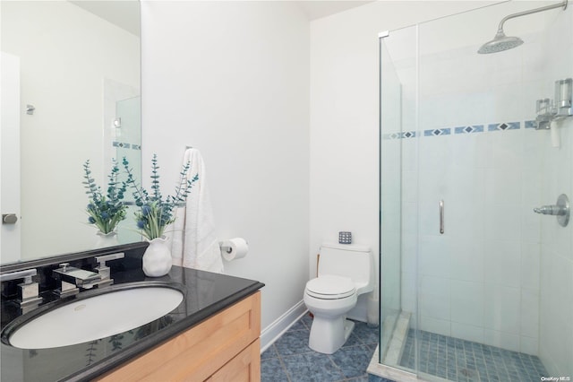 bathroom with tile patterned floors, vanity, toilet, and walk in shower