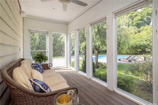 sunroom with ceiling fan and a healthy amount of sunlight