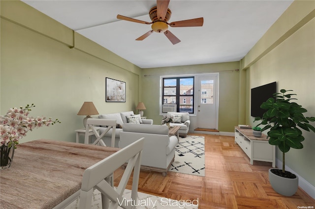 living room featuring ceiling fan and light parquet floors