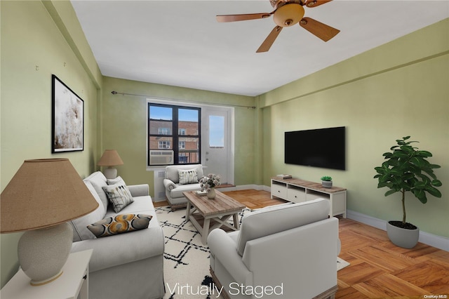 living room with light parquet flooring, ceiling fan, and cooling unit