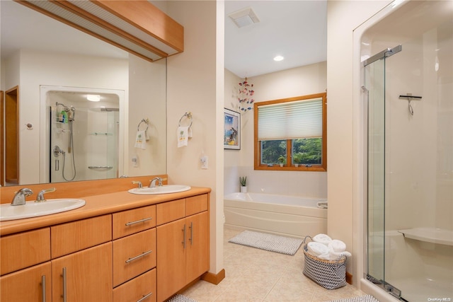 bathroom featuring tile patterned flooring, vanity, and independent shower and bath