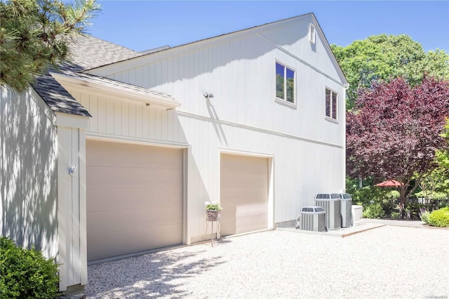 exterior space featuring a garage and central AC unit