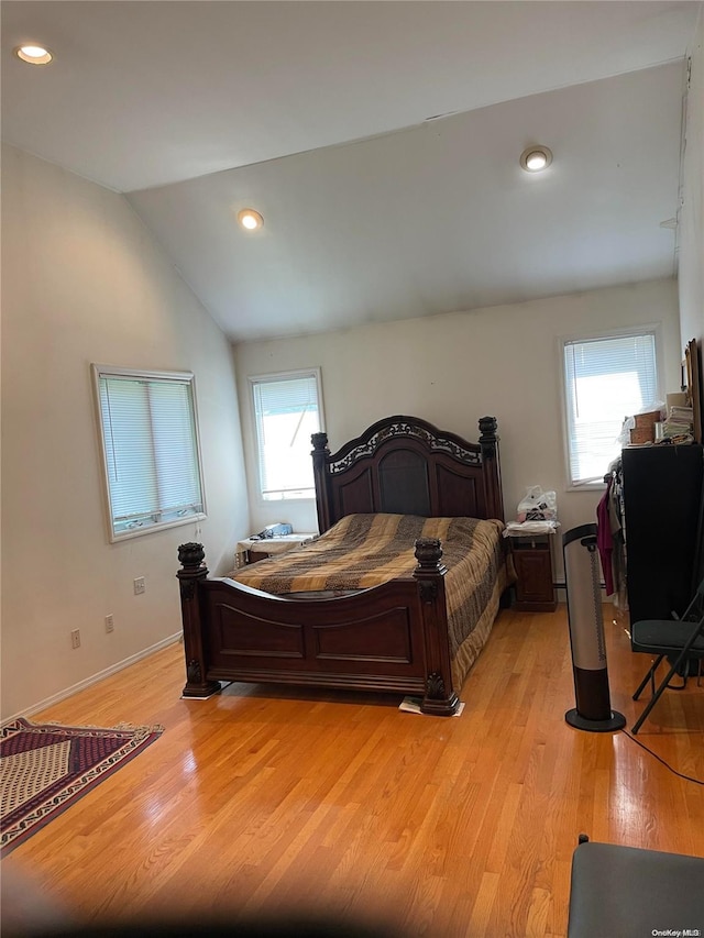 5 Devonshire Ln, Great Neck, NY 11023 - bedroom featuring light wood-type flooring, lofted ceiling, recessed lighting, and baseboards