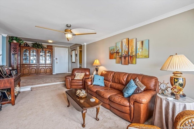 living room with crown molding, ceiling fan, and light carpet