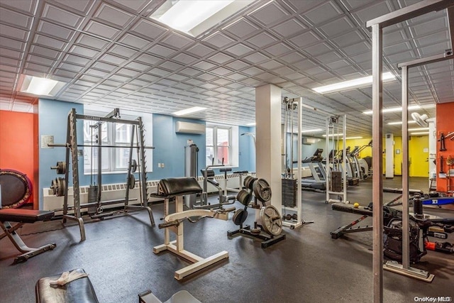 gym featuring an AC wall unit