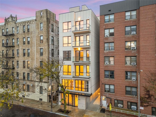 view of outdoor building at dusk