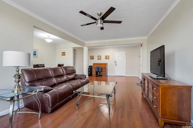 living room featuring ceiling fan and hardwood / wood-style flooring