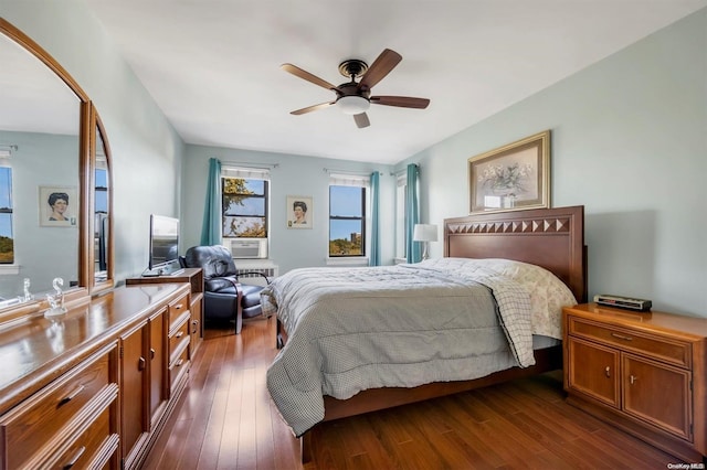 bedroom with ceiling fan and dark wood-type flooring