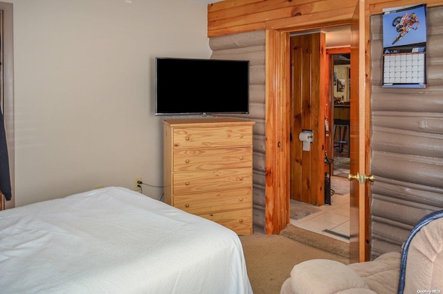 tiled bedroom with log walls