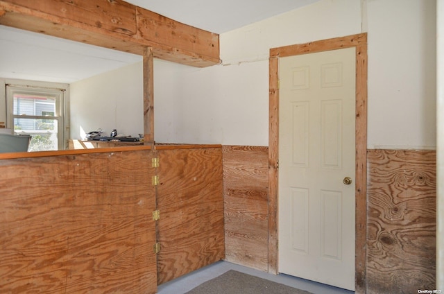 interior space featuring wooden walls