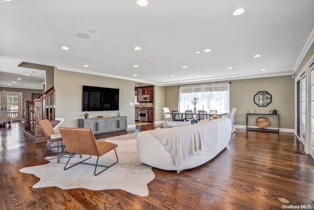 living room featuring dark hardwood / wood-style flooring and ornamental molding