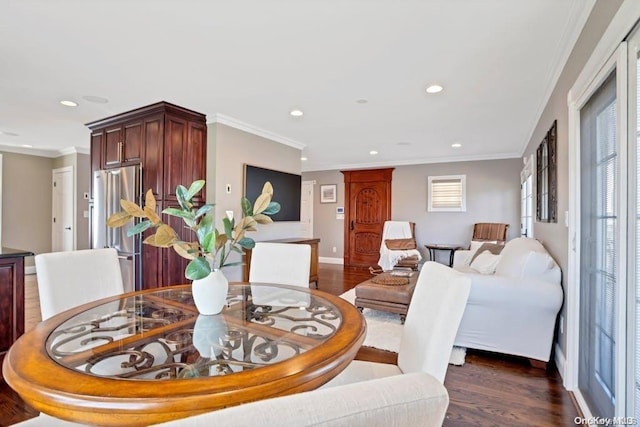 dining area featuring dark hardwood / wood-style floors and ornamental molding