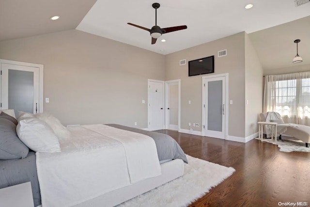 bedroom with dark hardwood / wood-style floors, ceiling fan, and lofted ceiling