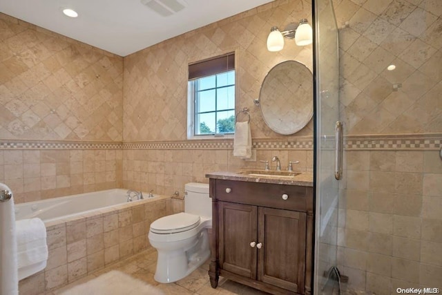 full bathroom with vanity, plus walk in shower, tile patterned flooring, toilet, and tile walls