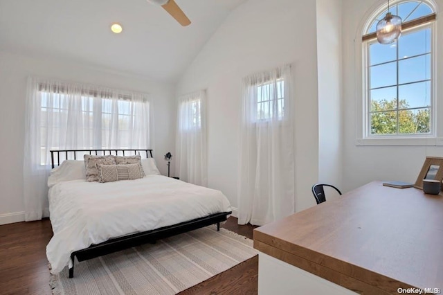 bedroom with lofted ceiling, multiple windows, dark wood-type flooring, and ceiling fan