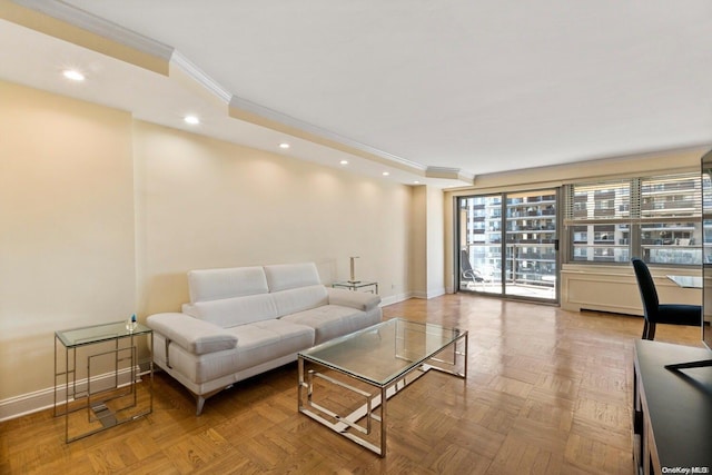 living room with ornamental molding and light parquet floors