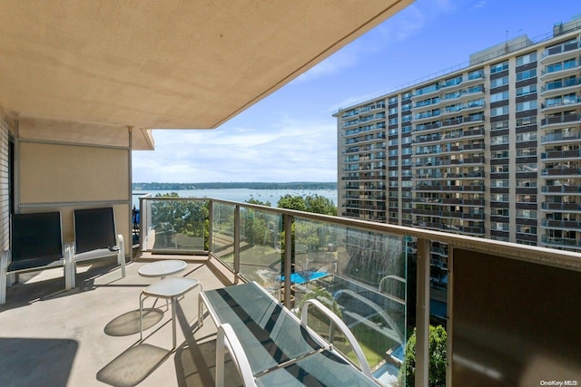 balcony featuring a water view