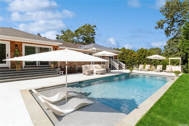 view of swimming pool with an outdoor hangout area and a patio area