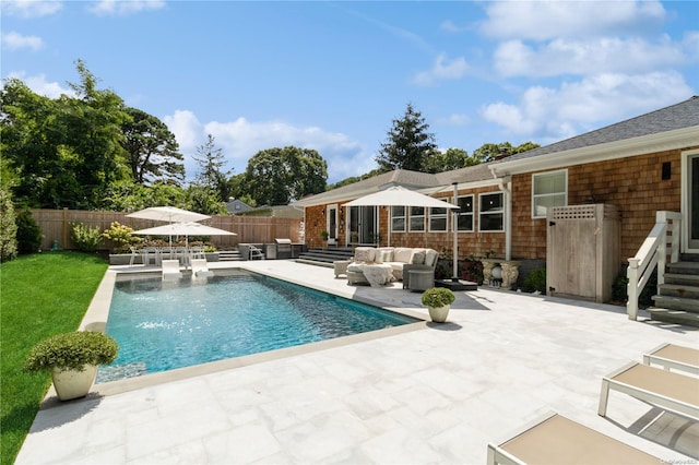 view of swimming pool with a patio and an outdoor hangout area