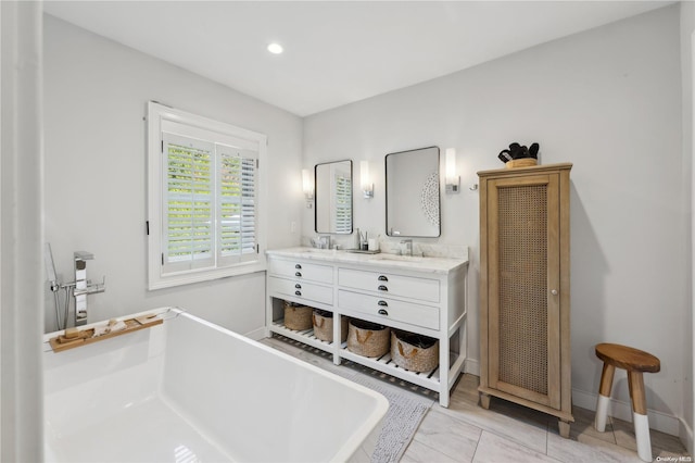 bathroom with vanity and a bathing tub