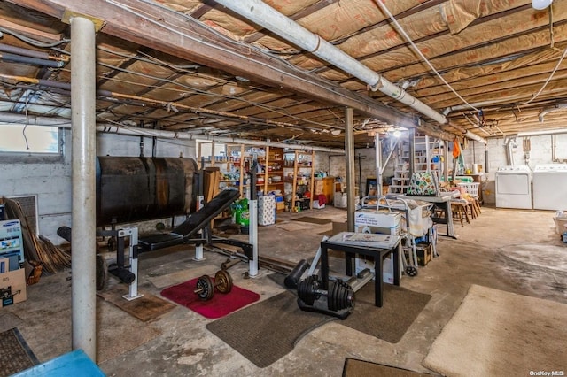 basement featuring washing machine and clothes dryer