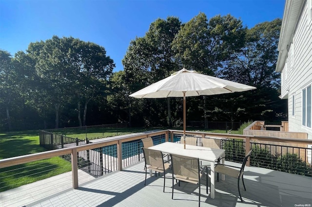 view of swimming pool with a wooden deck