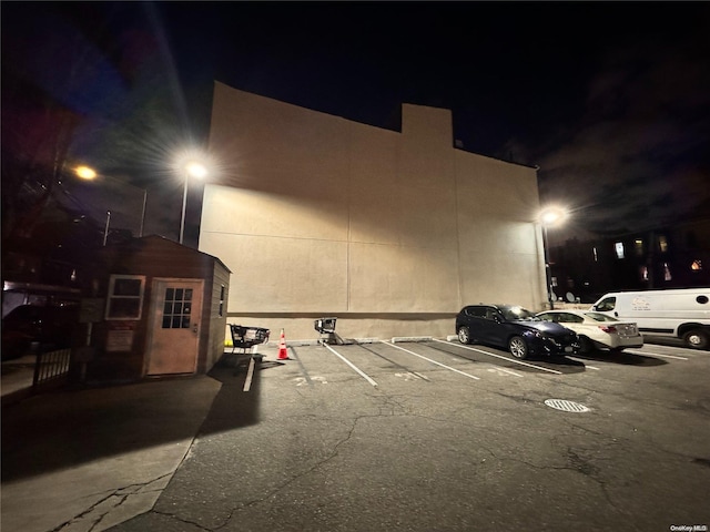 parking at night featuring uncovered parking