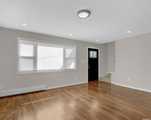 foyer with hardwood / wood-style flooring and a wealth of natural light