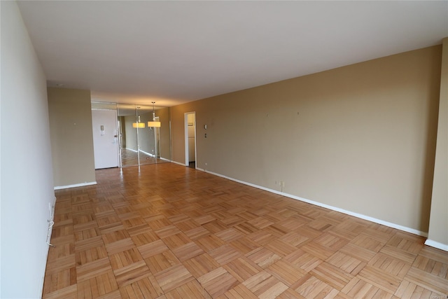 empty room with light parquet floors