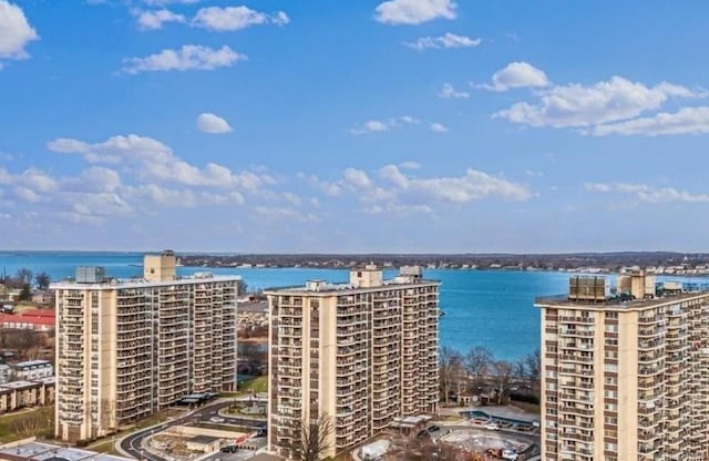 birds eye view of property with a water view