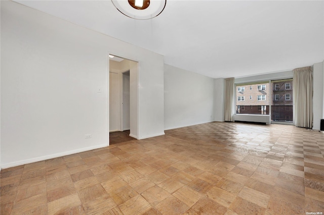 110-11 Queens Blvd Unit F4, Forest Hills, NY 11375 - unfurnished living room featuring baseboards