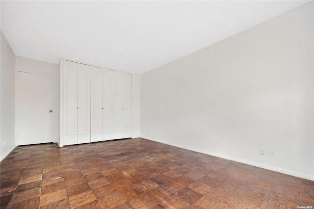 110-11 Queens Blvd Unit F4, Forest Hills, NY 11375 - unfurnished bedroom with baseboards and a closet