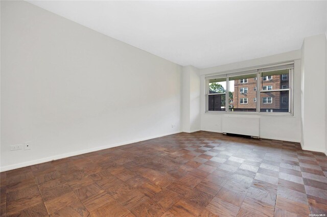 110-11 Queens Blvd Unit F4, Forest Hills, NY 11375 - empty room with radiator and baseboards