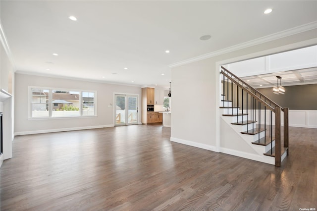 unfurnished living room featuring beam ceiling, crown molding, dark wood-type flooring, and coffered ceiling