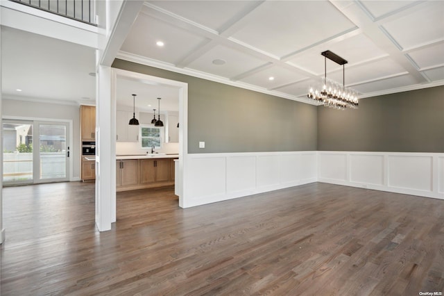 80 Ocean Ave, Massapequa, NY 11758 - unfurnished dining area featuring a sink, a chandelier, coffered ceiling, ornamental molding, and dark wood-type flooring
