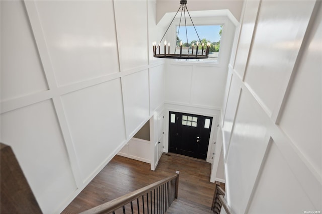 80 Ocean Ave, Massapequa, NY 11758 - foyer entrance with a decorative wall, a notable chandelier, and wood finished floors